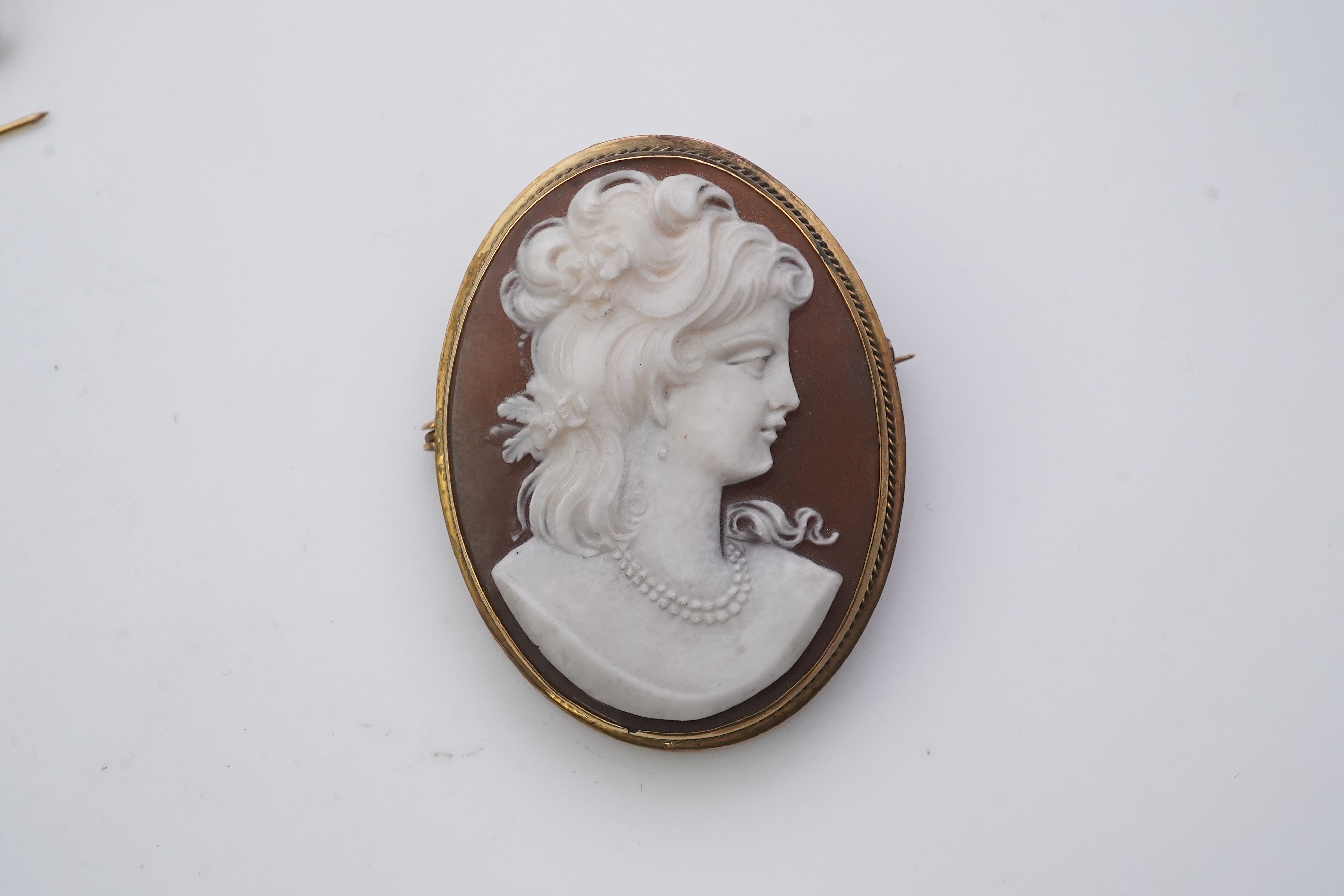 Three shell cameo brooches, 20th century